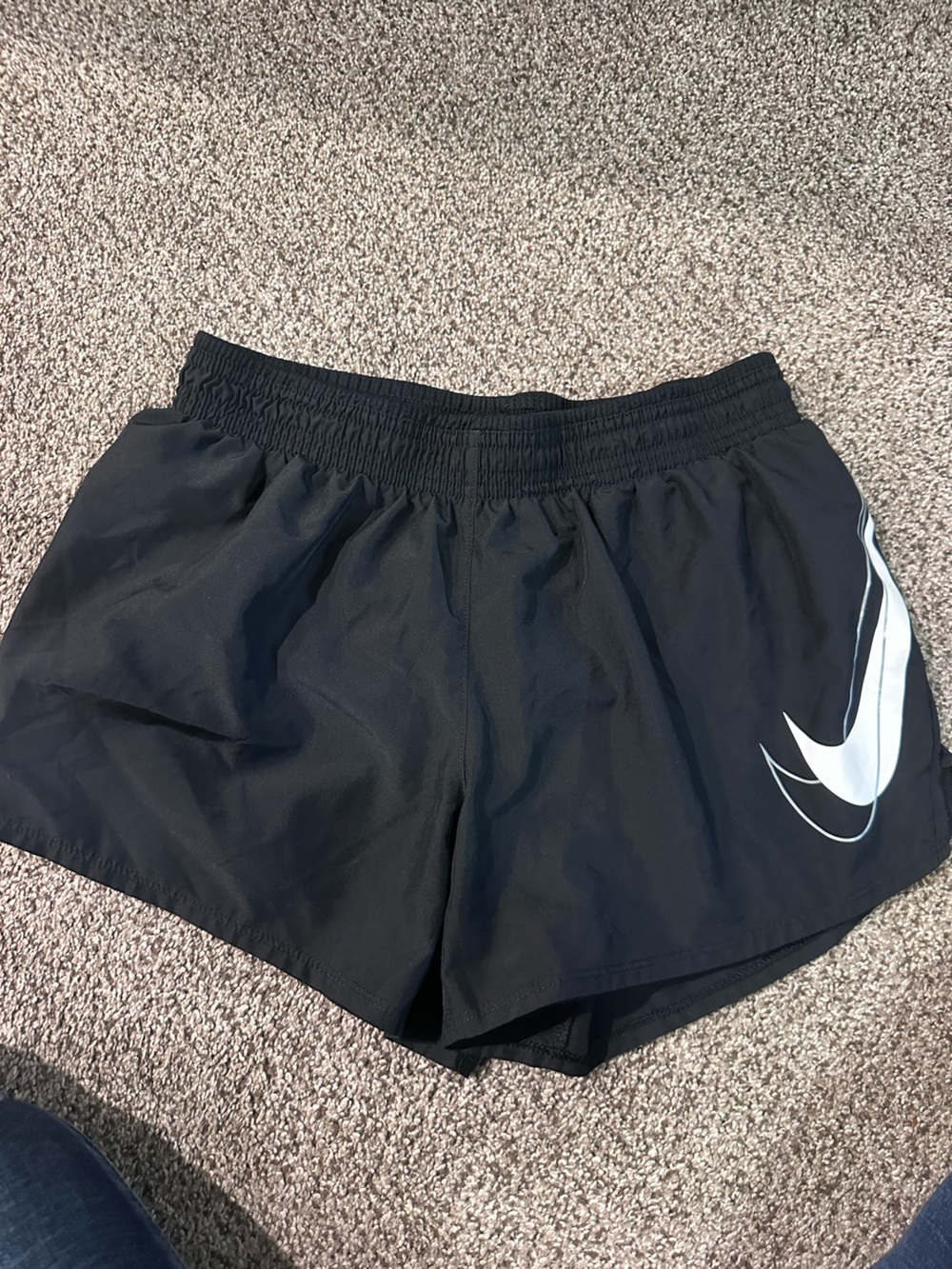 Nike Black Athletic Shorts with White Swoosh Accent